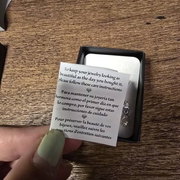 New Avon silvertone earrings 5 pairs, box and care instructions included - Picture 7 of 8